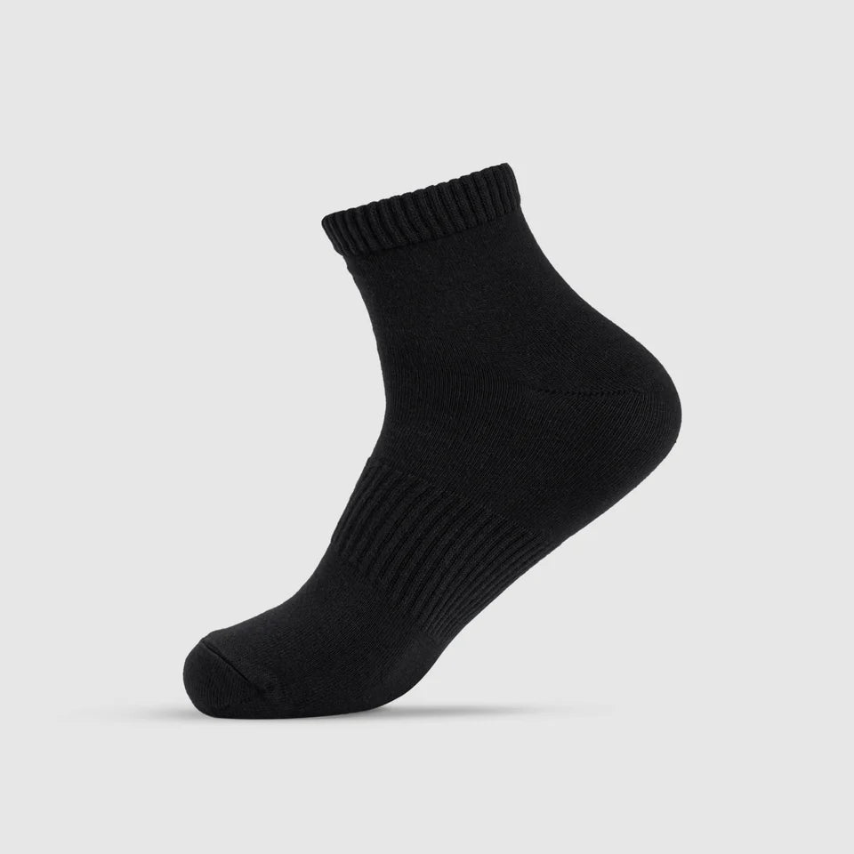 A black sock on a gray background.
